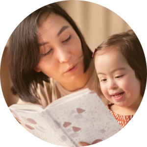 A mother reading a book to her special needs child