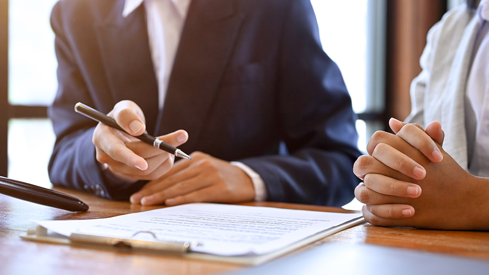 Lawyer reviewing estate plan with client