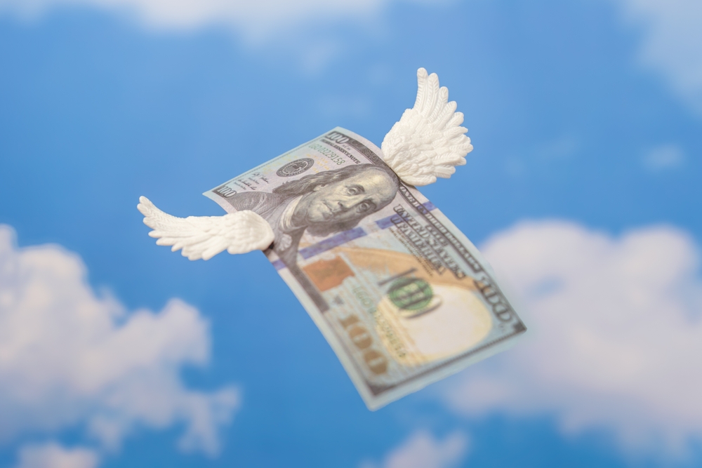 A,Hundred-dollar,Bill,With,Small,White,Wings.,Money,Flying,Away,